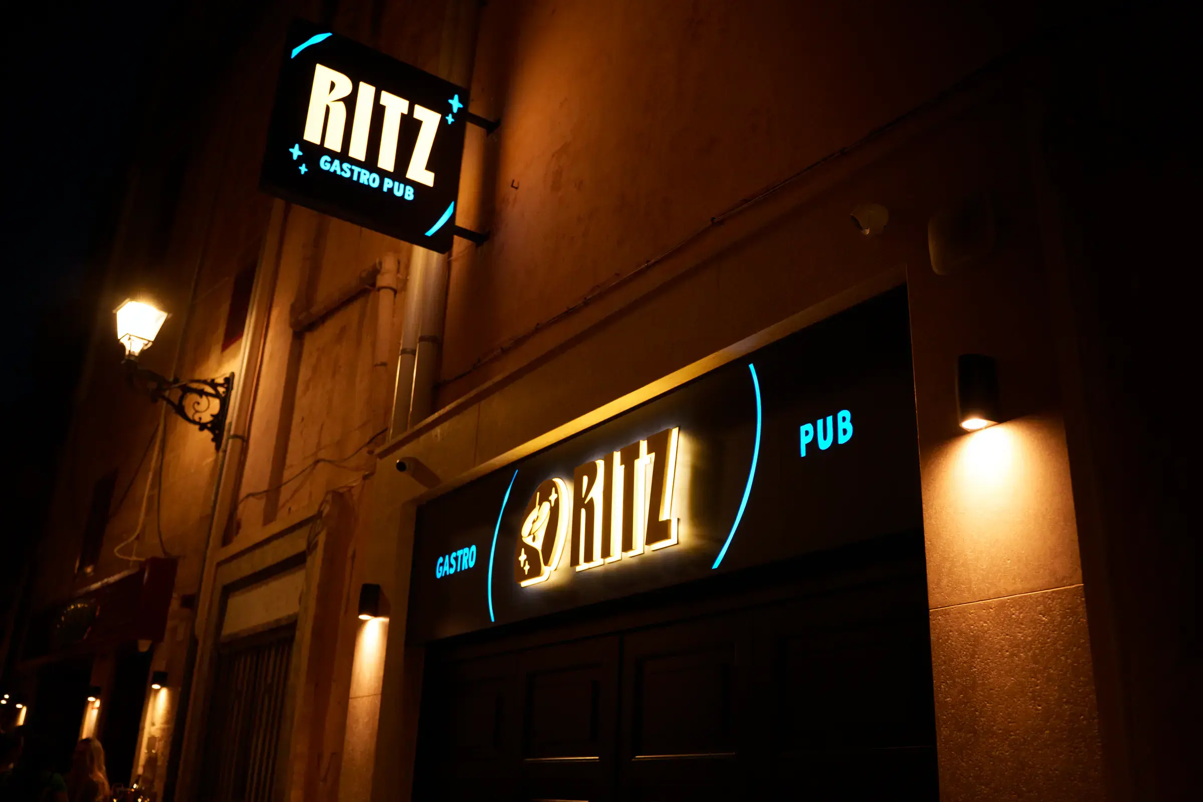 The Ritz entrance lit up at night