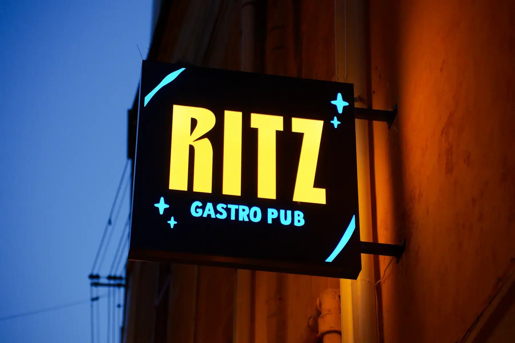The Ritz Gastro Pub sign at blue hour