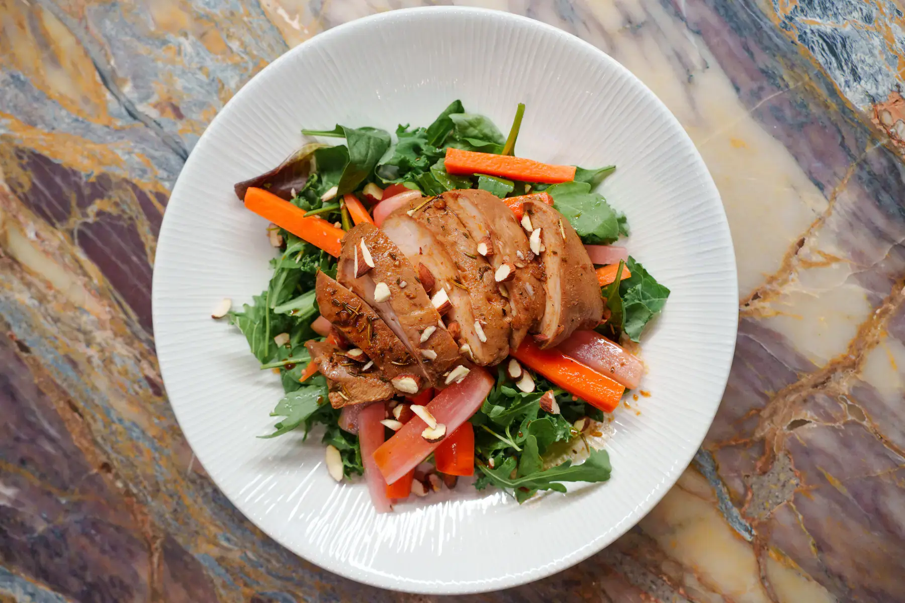 Chicken salad with balsamic-marinated chicken breast and mixed leaves