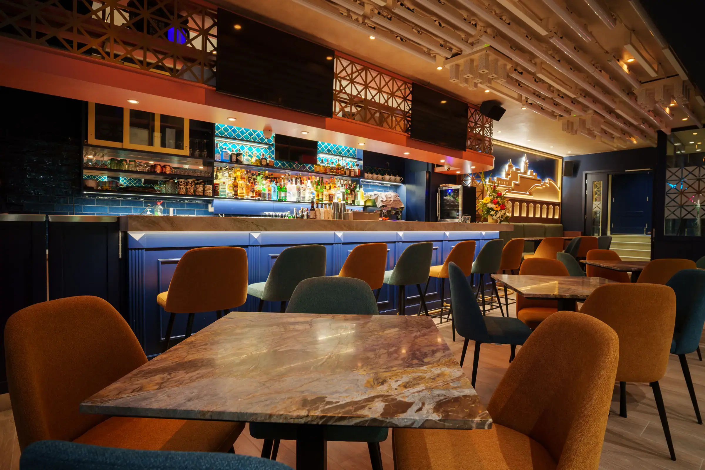 Marble tables in front of the bar