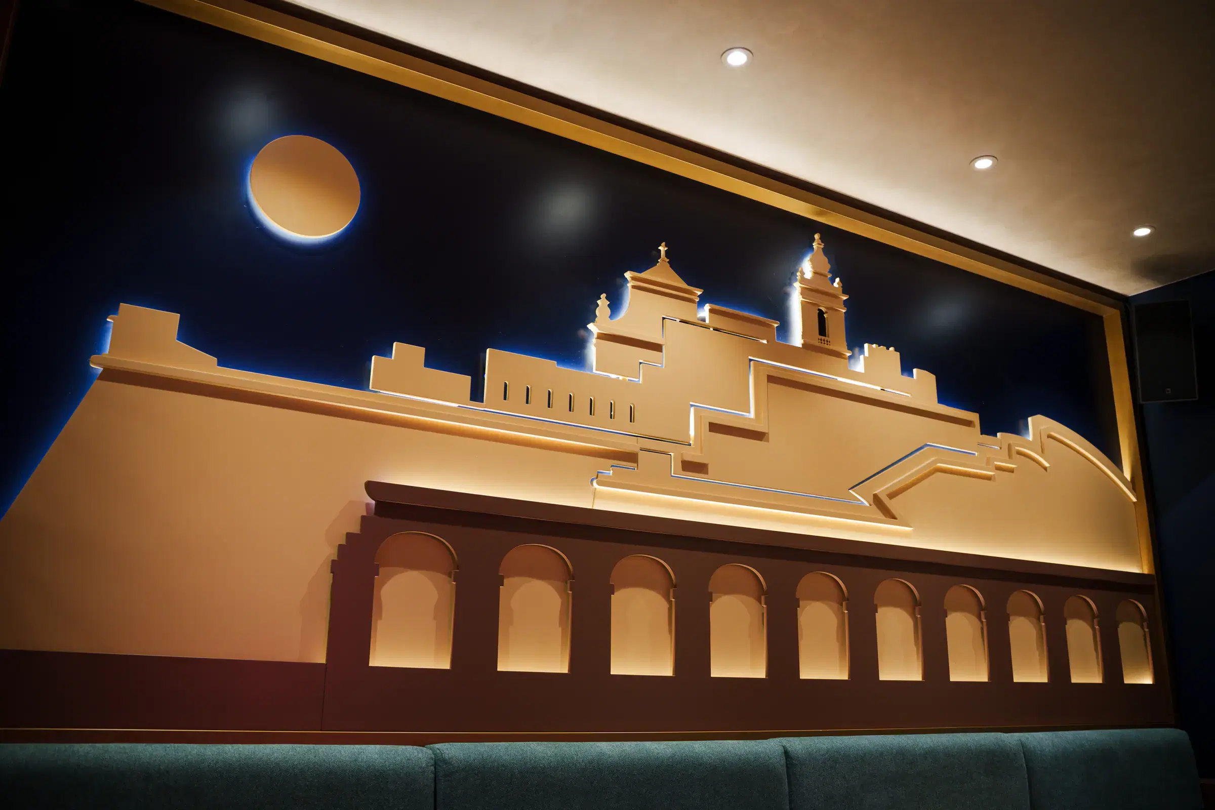 The illuminated Cittadella skyline relief